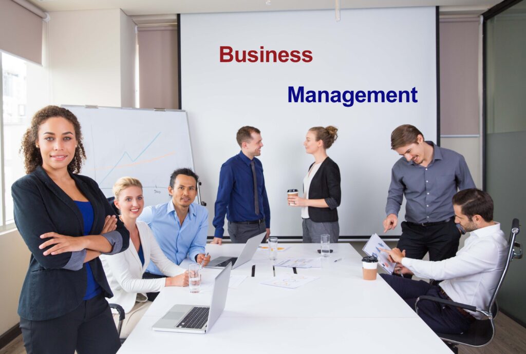 Businesswoman With Team in Conference Room